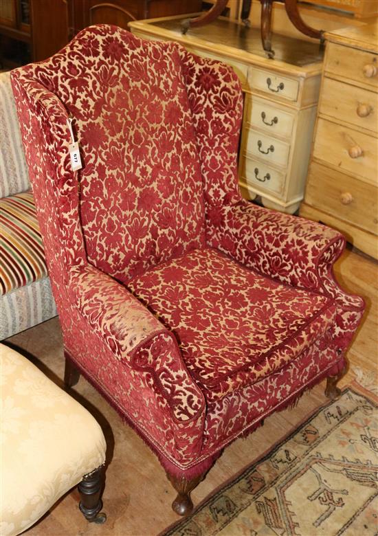 Upholstered wing armchair